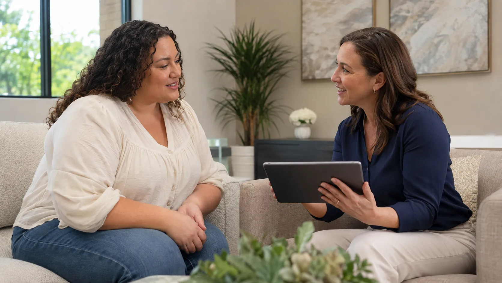 Prospective surrogate discussing the BMI requirement with an experienced agency program director